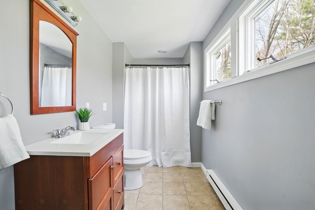 11 Old Oaken Bucket Road Norwell, MA 02061 - Photo 5 of 39 a bathroom with a sink vanity granite and toilet
