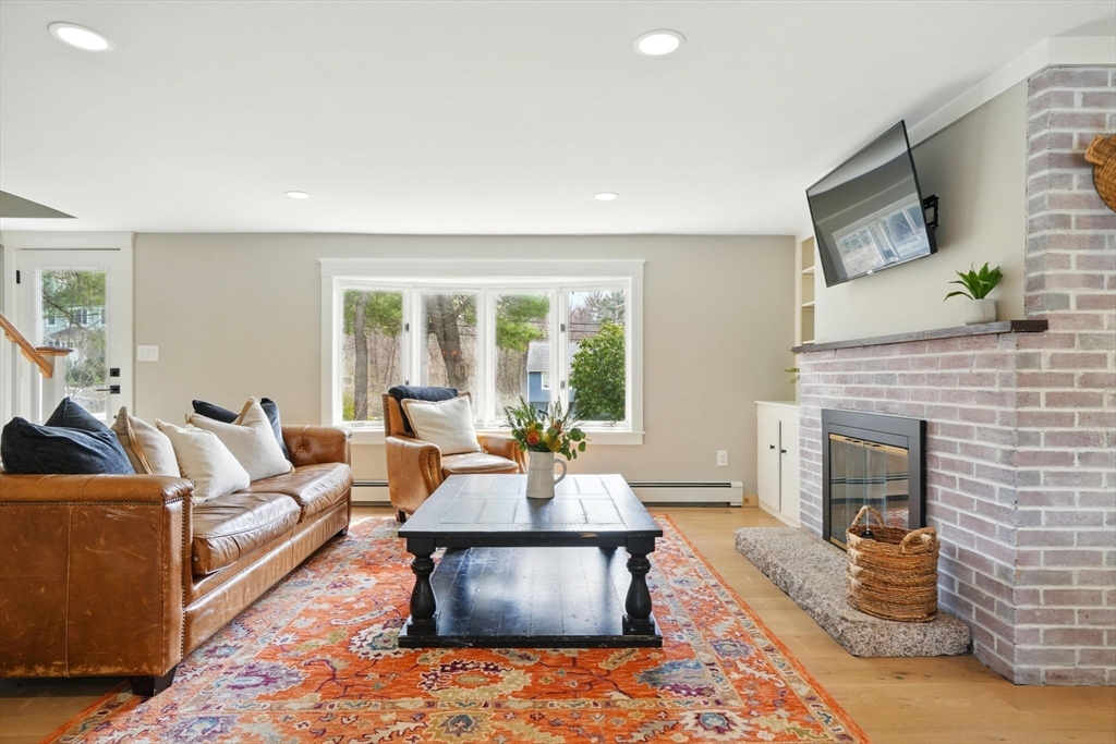 11 Old Oaken Bucket Road Norwell, MA 02061 - Photo 8 of 39 a living room with furniture and a fireplace