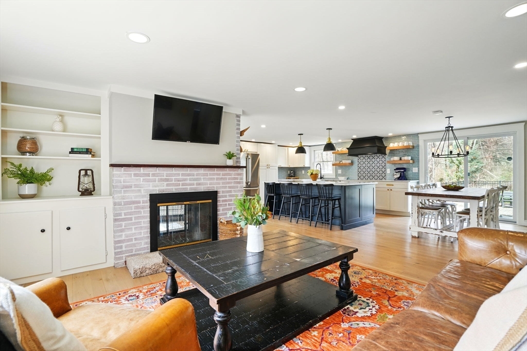 11 Old Oaken Bucket Road Norwell, MA 02061 - Photo 9 of 39 a living room with furniture and a fireplace