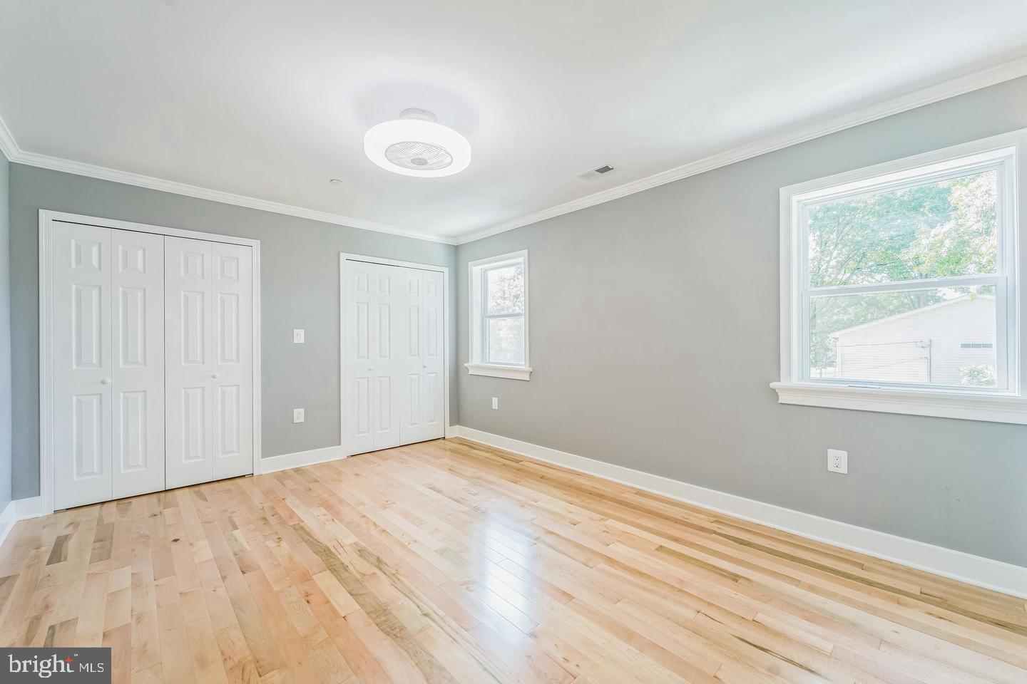 1123 Odenton Road Odenton, MD 21113 - Photo 16 of 22 a view of an empty room with wooden floor and a window