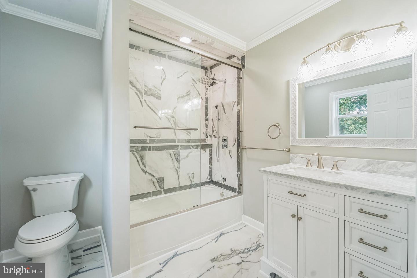1123 Odenton Road Odenton, MD 21113 - Photo 17 of 22 a bathroom with a granite countertop sink toilet and shower
