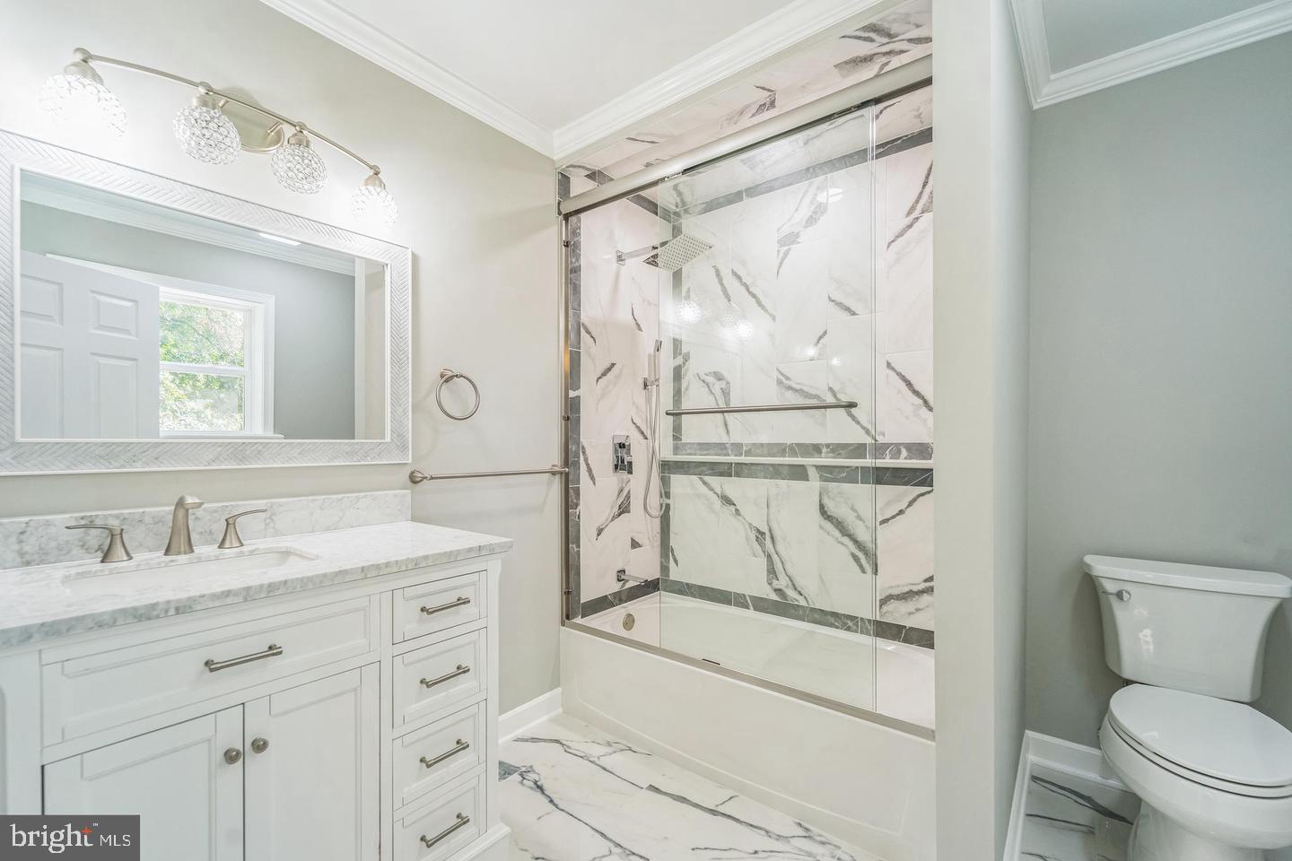 1123 Odenton Road Odenton, MD 21113 - Photo 19 of 22 a bathroom with a granite countertop sink a toilet and a mirror