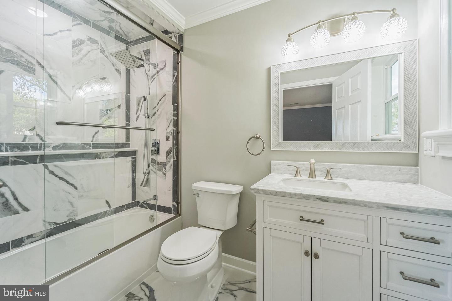 1123 Odenton Road Odenton, MD 21113 - Photo 22 of 22 a bathroom with a granite countertop toilet sink and mirror