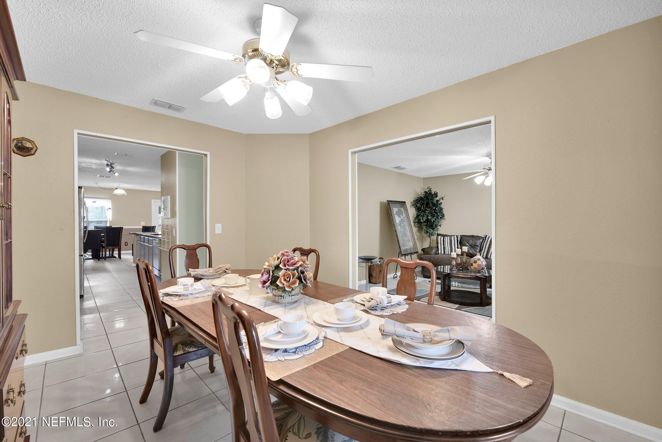 2603 Springwillow Drive Jacksonville, FL 32221 - Photo 8 of 30 a dining room with furniture and wooden floor