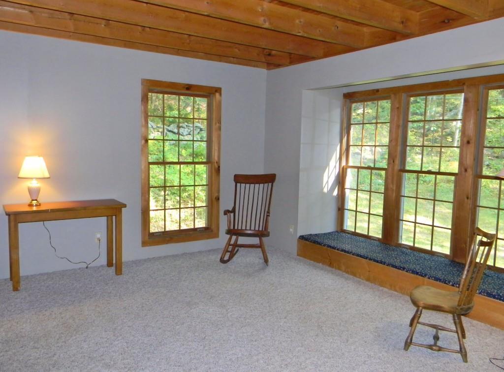348 Fosters Point Road West Bath, ME 04530 - Photo 9 of 29 Living room with large windows and...
