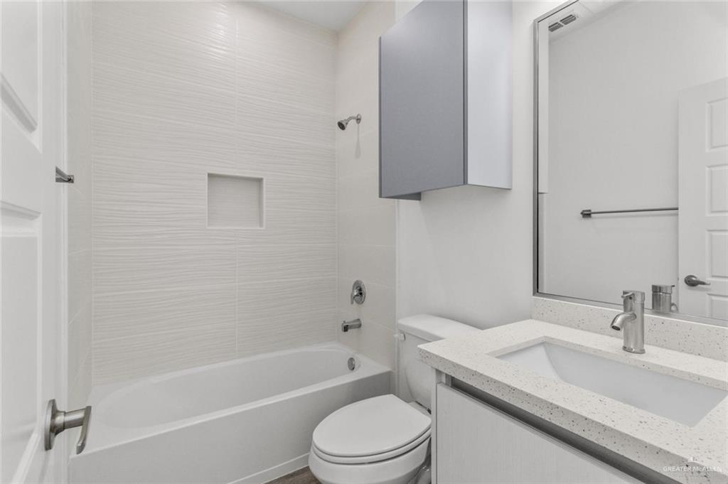 304 West Campeche Avenue, Unit 1 Alton, TX 78573 - Photo 9 of 11 Bathroom featuring vanity and shower / bath combination