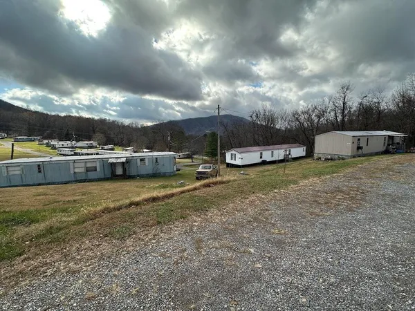 a view of a yard with table and chairs