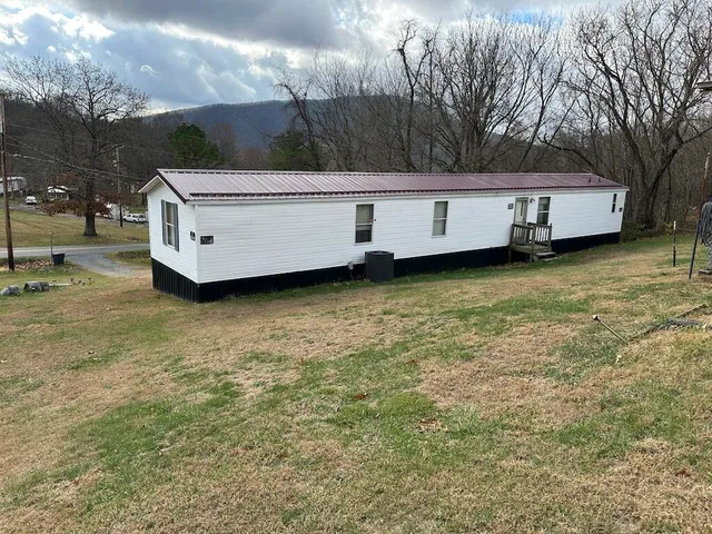 a view of a couches in a backyard of house