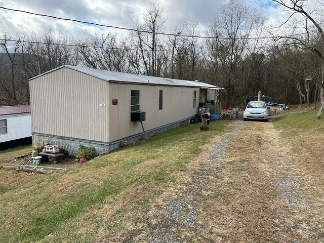 a view of a back yard of the house