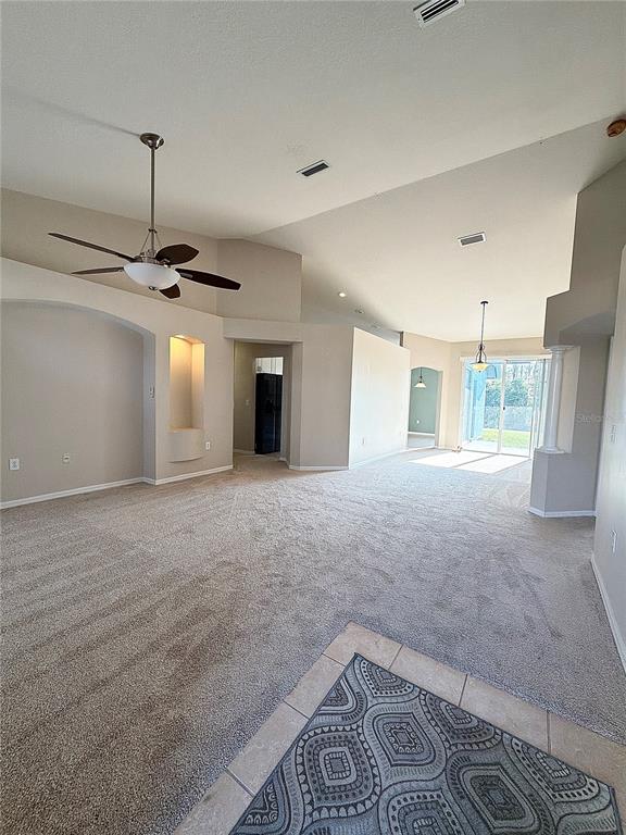 31224 Crestmont Court Wesley Chapel, FL 33543 - Photo 2 of 36 a view of an empty room with a window
