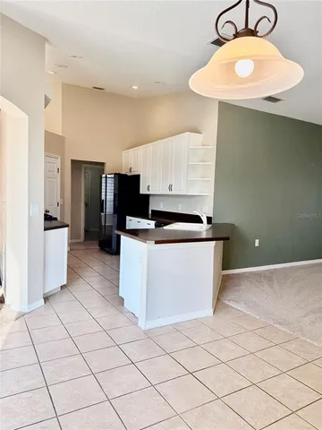 a kitchen with stainless steel appliances a refrigerator sink and stove