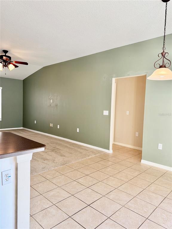 31224 Crestmont Court Wesley Chapel, FL 33543 - Photo 23 of 36 a view of an empty room with wooden floor
