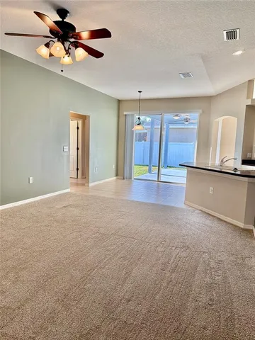 a view of a livingroom with a ceiling fan