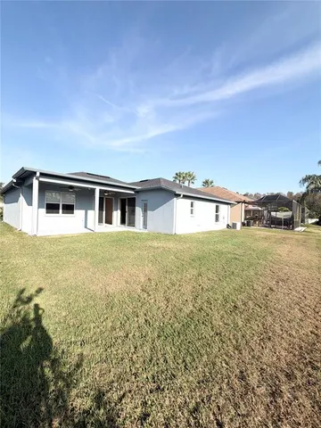 a big yard with large trees