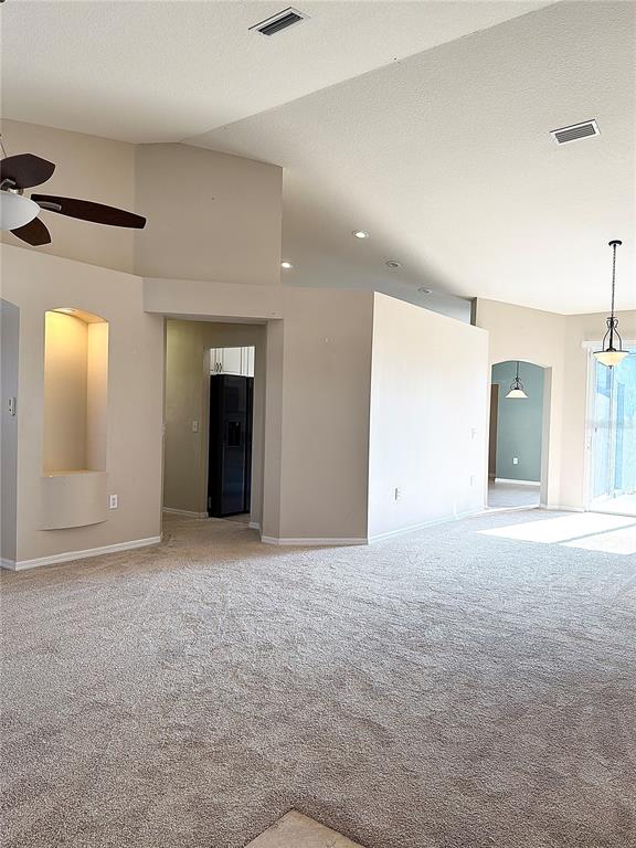 31224 Crestmont Court Wesley Chapel, FL 33543 - Photo 8 of 36 an empty room with windows and closet