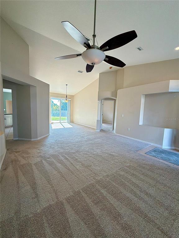 31224 Crestmont Court Wesley Chapel, FL 33543 - Photo 9 of 36 a view of a livingroom with a ceiling fan and window