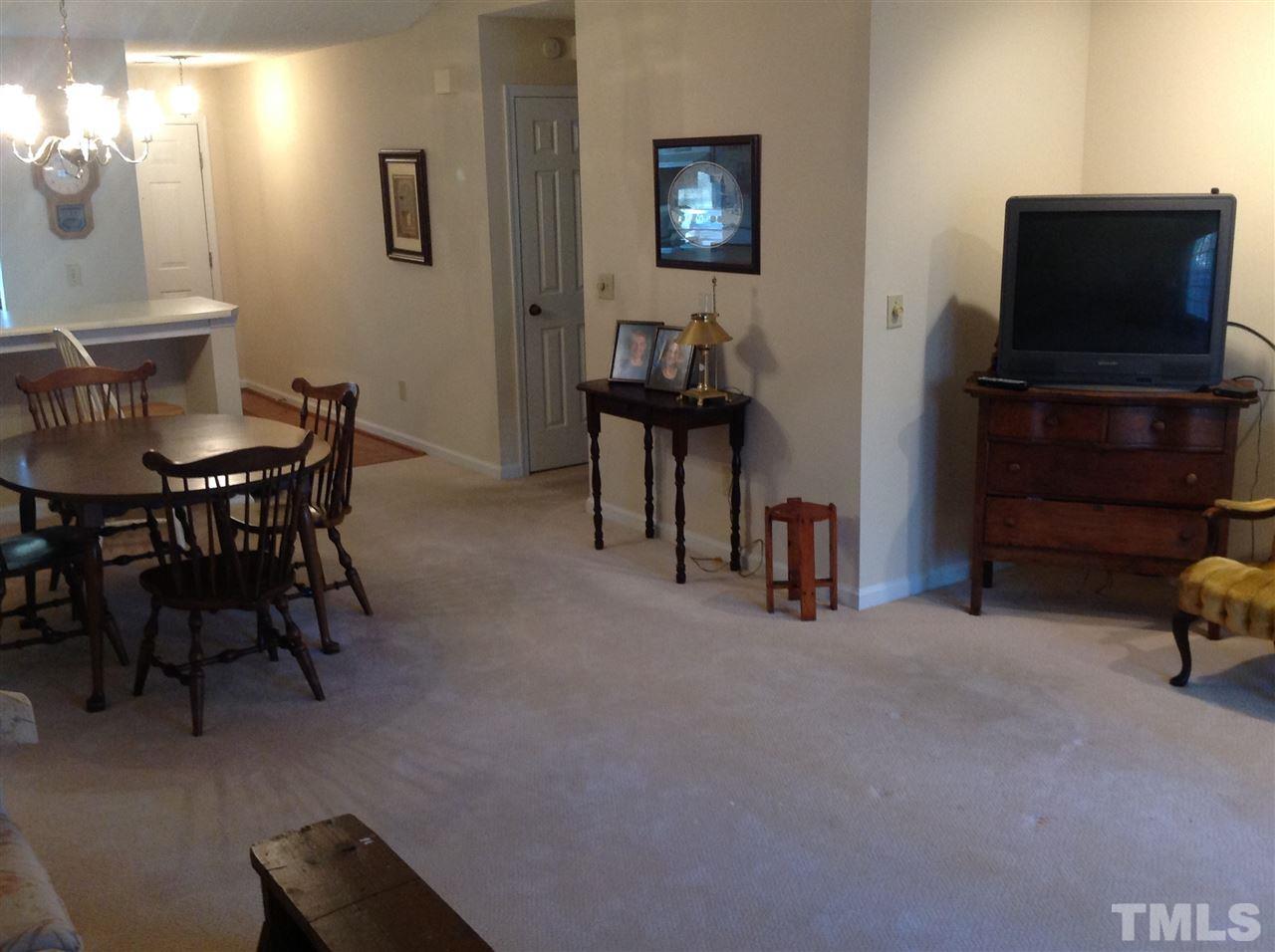 2632 Cottage Circle Raleigh, NC 27613 - Photo 2 of 10 a view of a livingroom with furniture and a flat screen tv