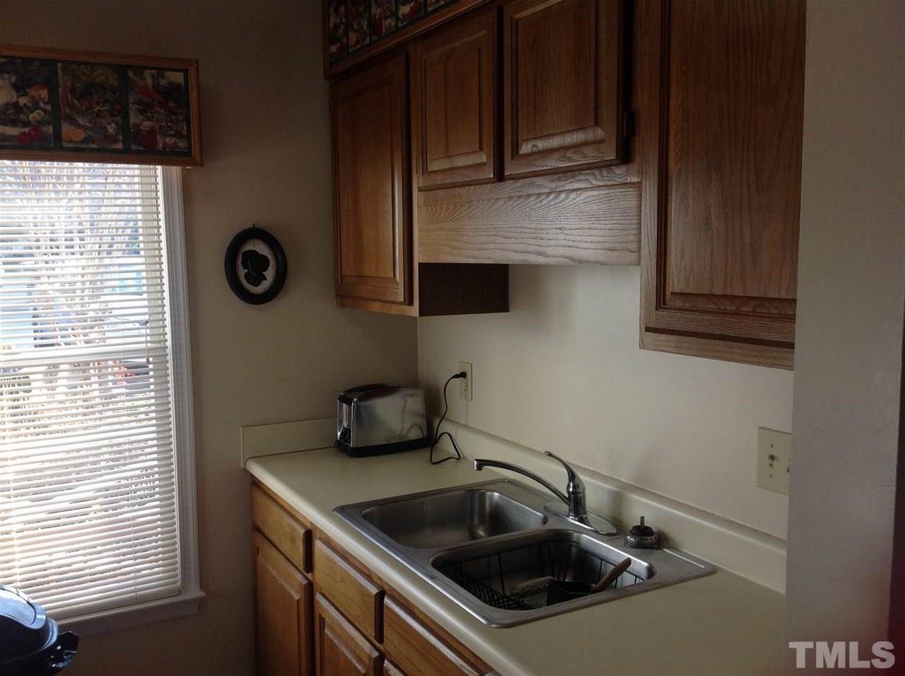 2632 Cottage Circle Raleigh, NC 27613 - Photo 5 of 10 a kitchen with a sink and cabinets