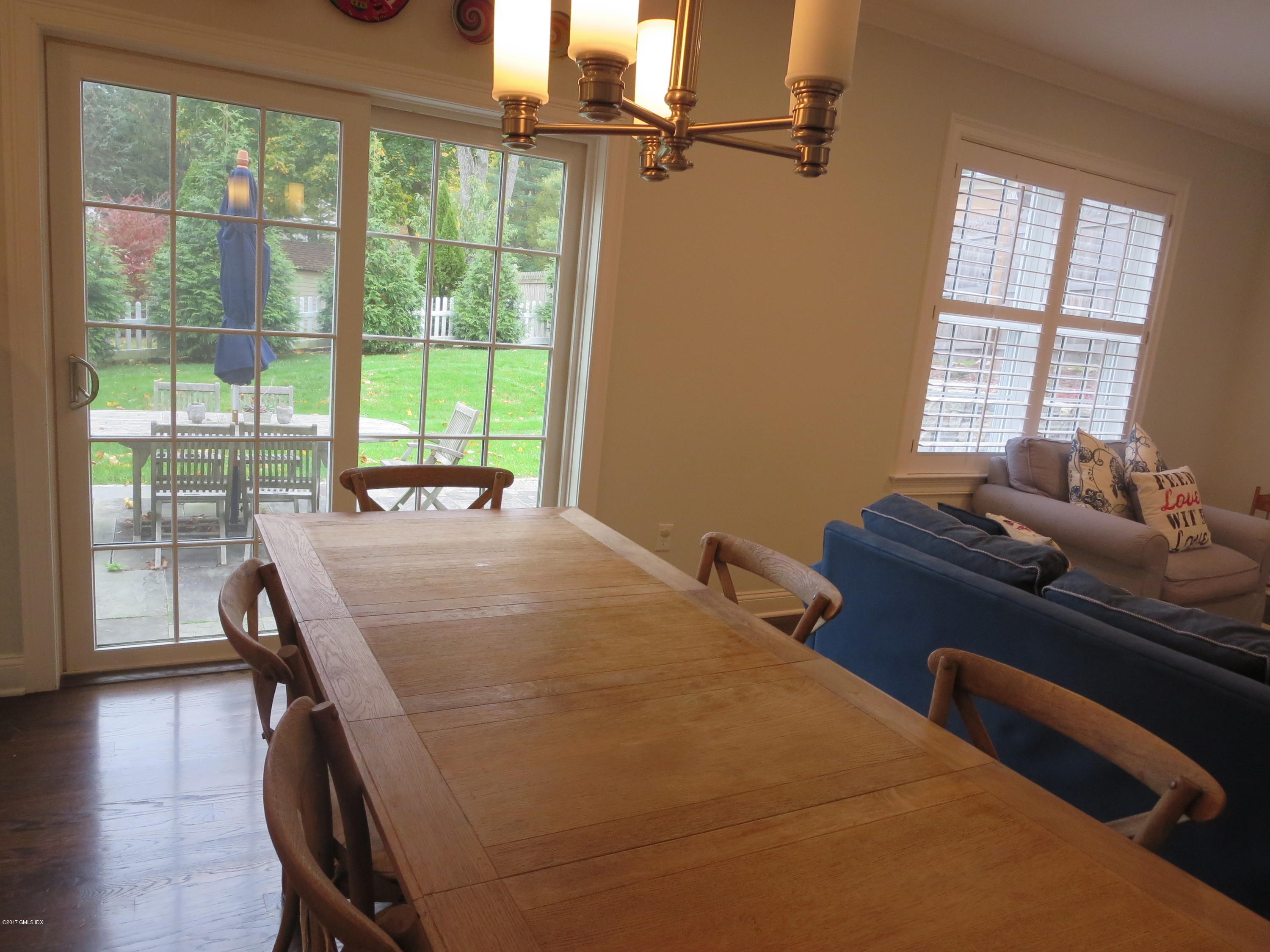 551 River Road Cos Cob, CT 06870 - Photo 15 of 40 a bed room with a bed and a chair