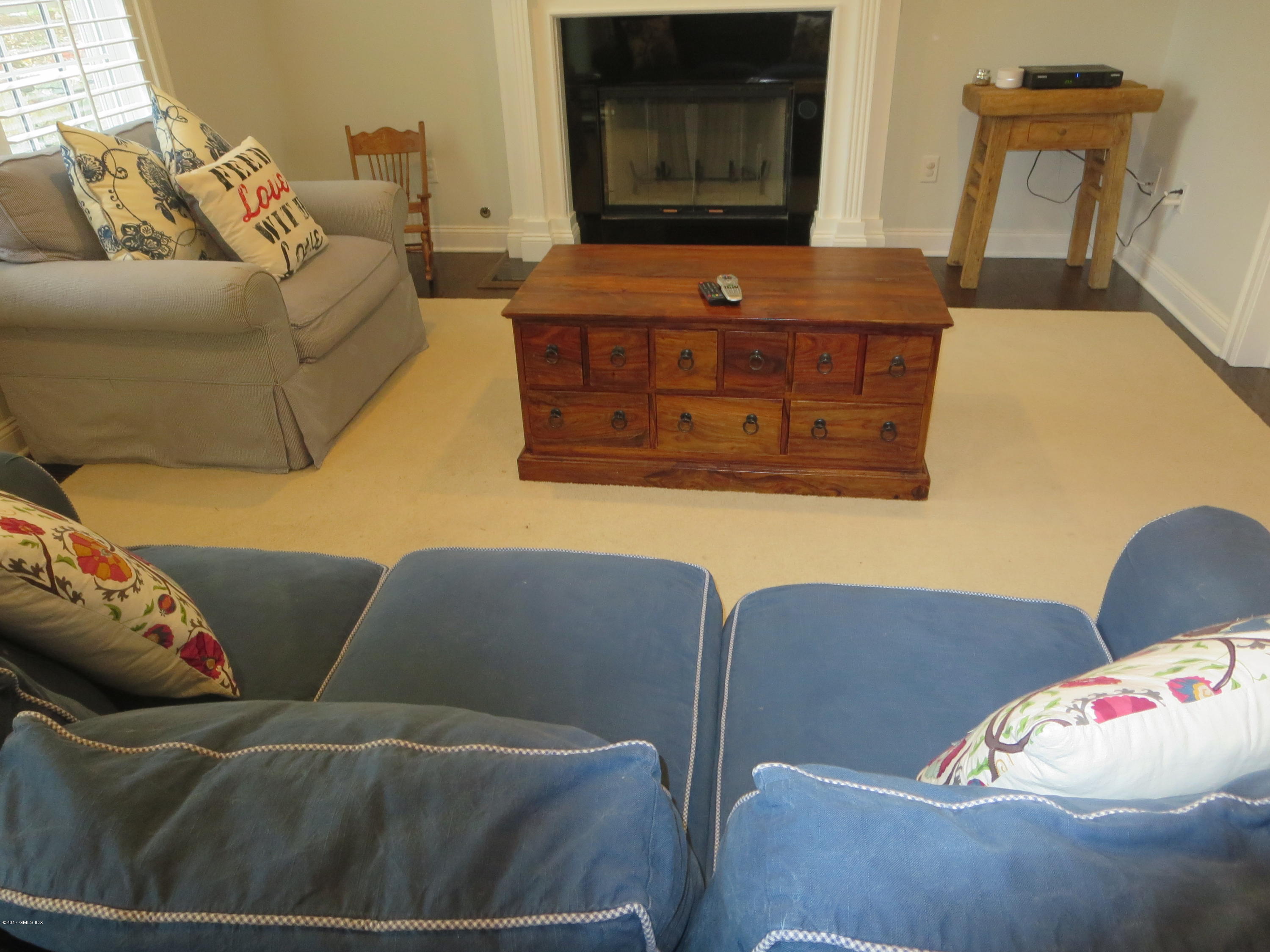 551 River Road Cos Cob, CT 06870 - Photo 16 of 40 a living room with furniture and a fireplace