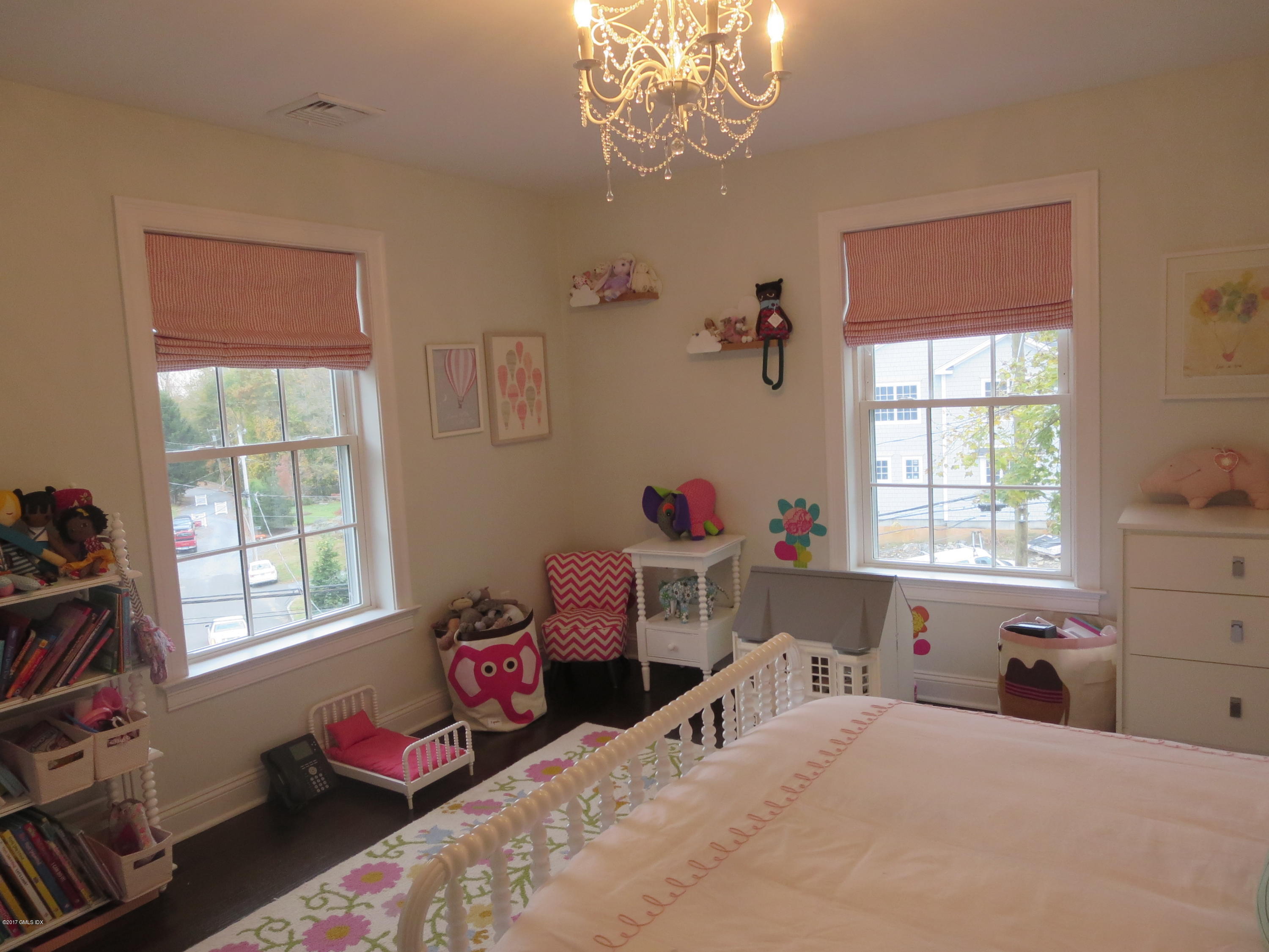551 River Road Cos Cob, CT 06870 - Photo 20 of 40 a bedroom with a bed and a window