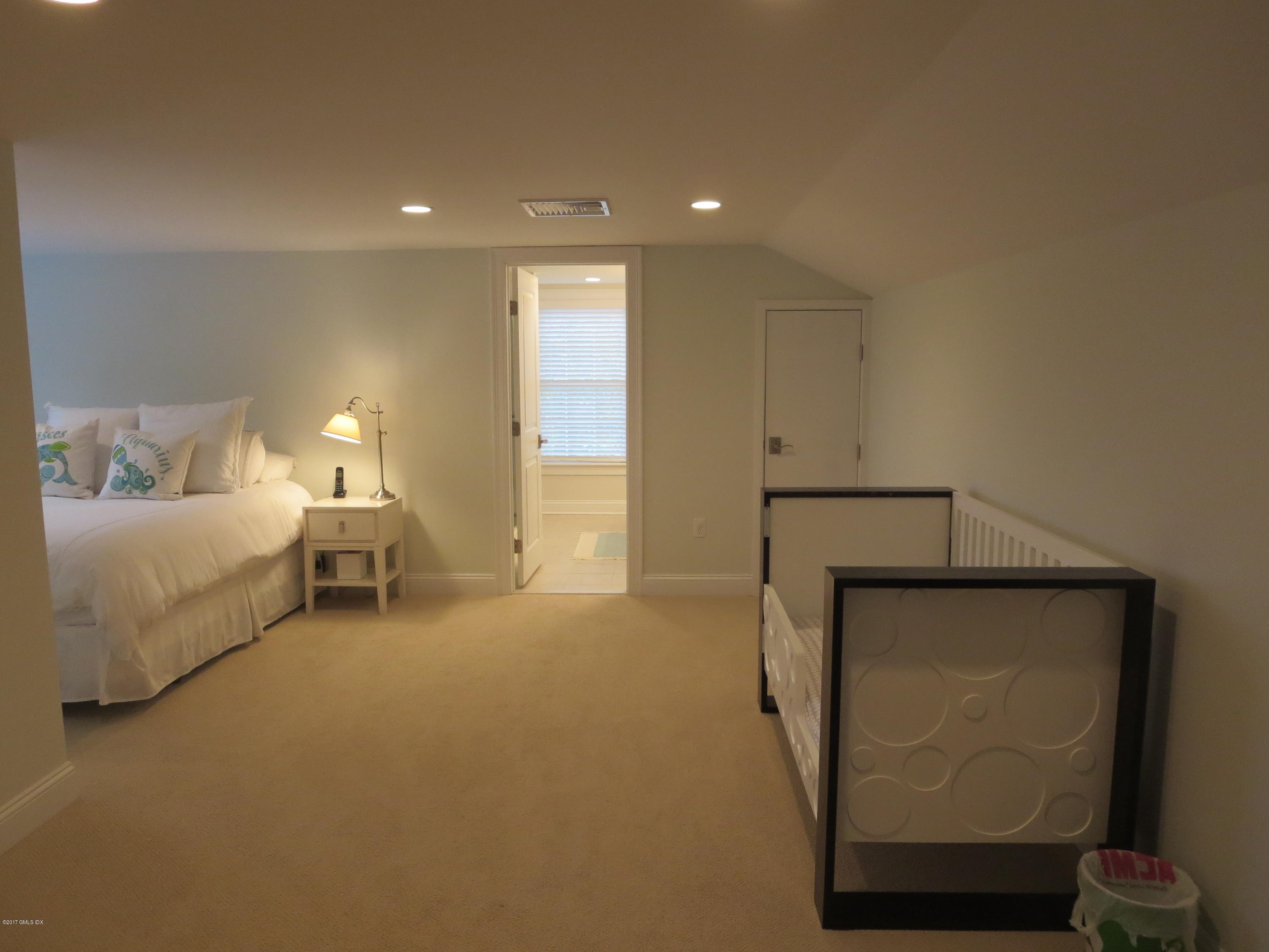 551 River Road Cos Cob, CT 06870 - Photo 27 of 40 a living room with furniture and a table