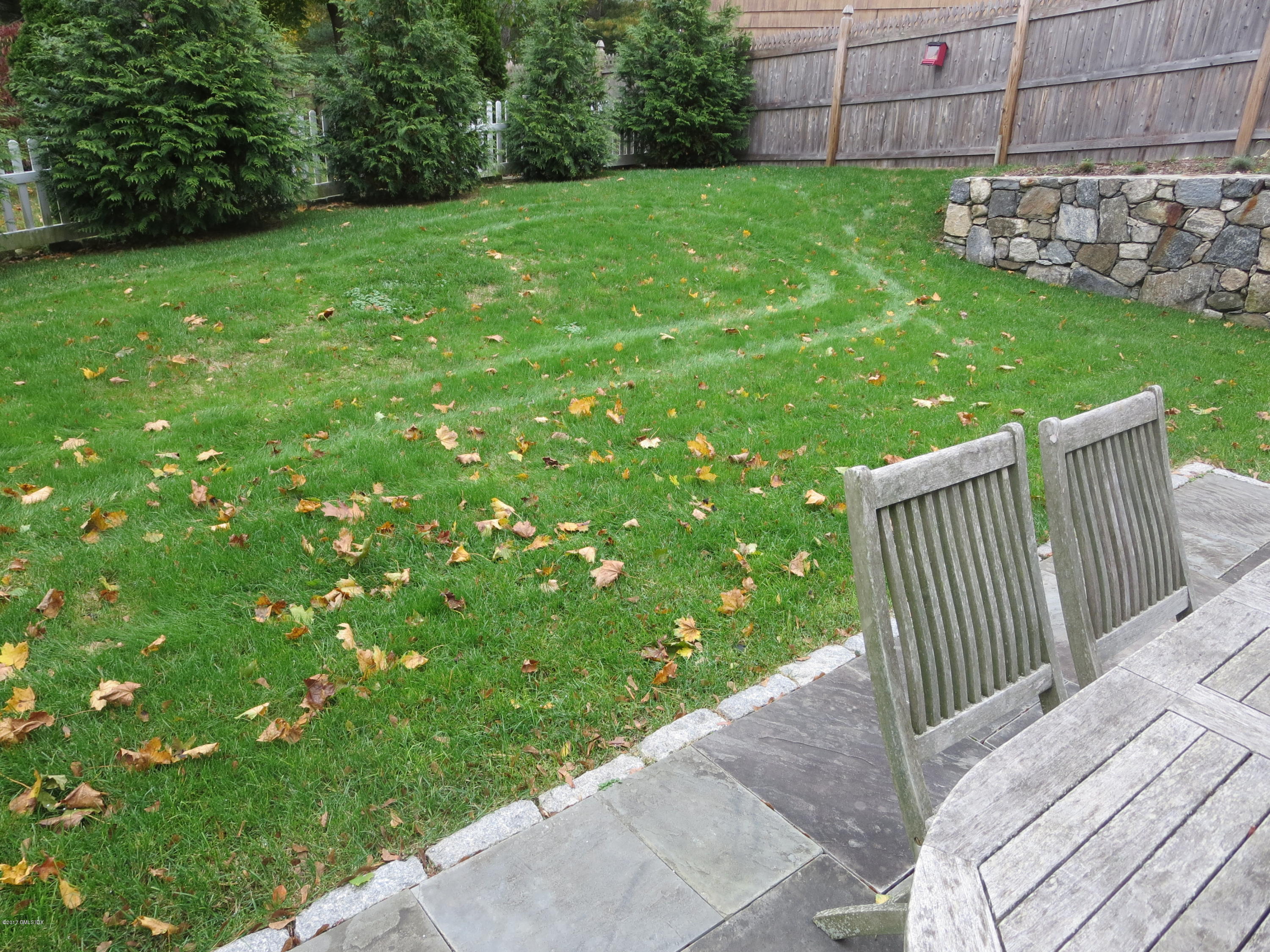 551 River Road Cos Cob, CT 06870 - Photo 35 of 40 a view of a backyard with a garden