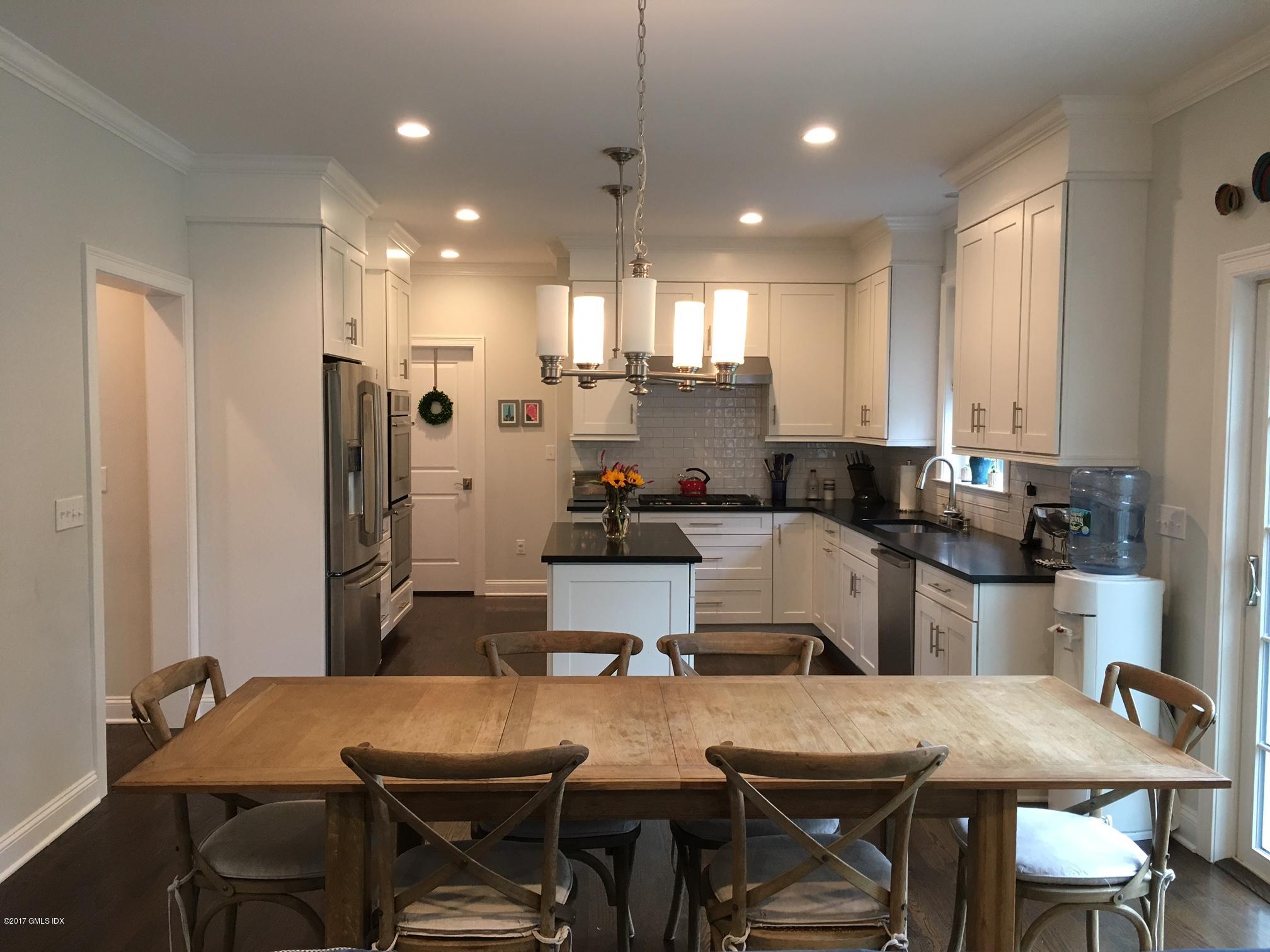 551 River Road Cos Cob, CT 06870 - Photo 10 of 40 a kitchen with refrigerator and cabinets