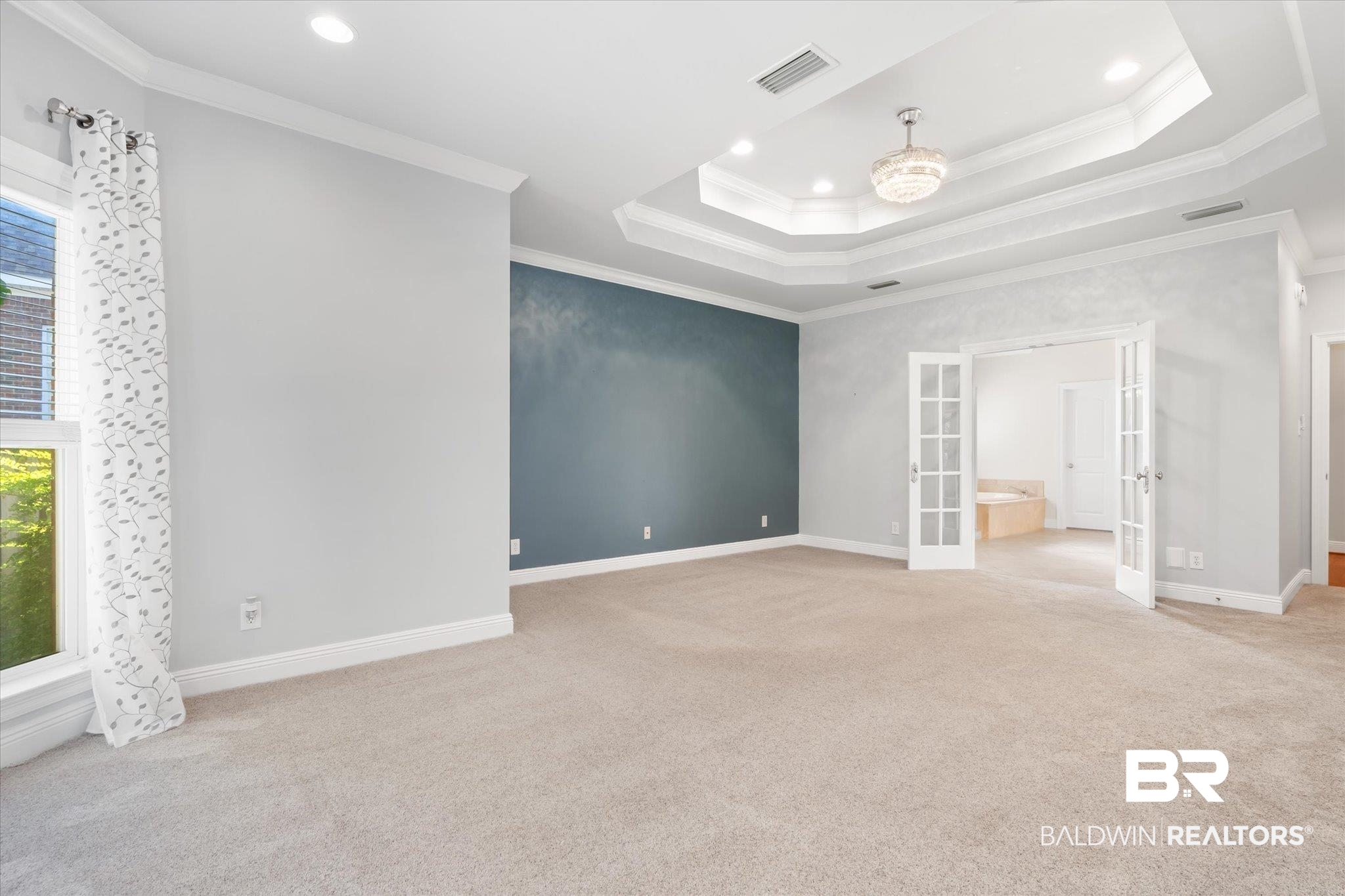 10730 Flagstone Drive Mobile, AL 36608 - Photo 11 of 20 Carpeted spare room featuring ornamental molding, french doors, and a healthy amount of sunlight