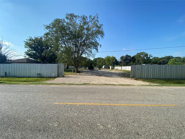 a view of a swimming pool and a yard
