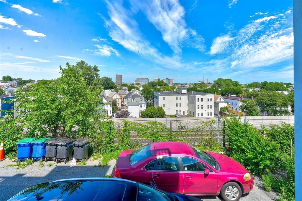 285 Medford Street, Unit 2 Somerville, MA 02143 - Photo 11 of 11 a view of yard with swimming pool and outdoor seating