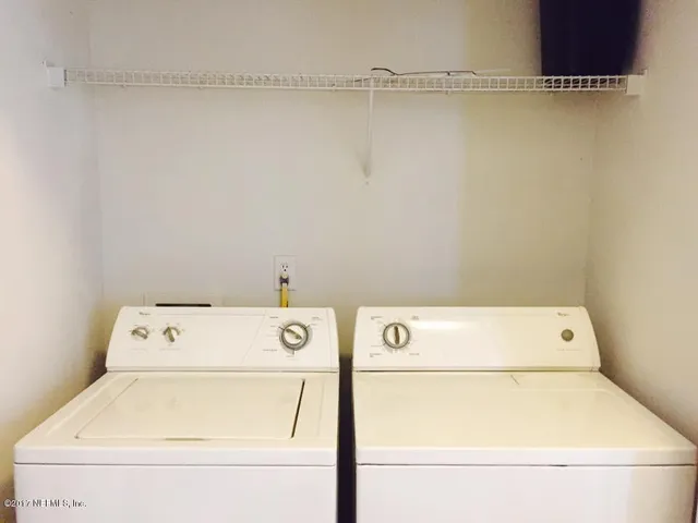 a utility room with dryer and washer