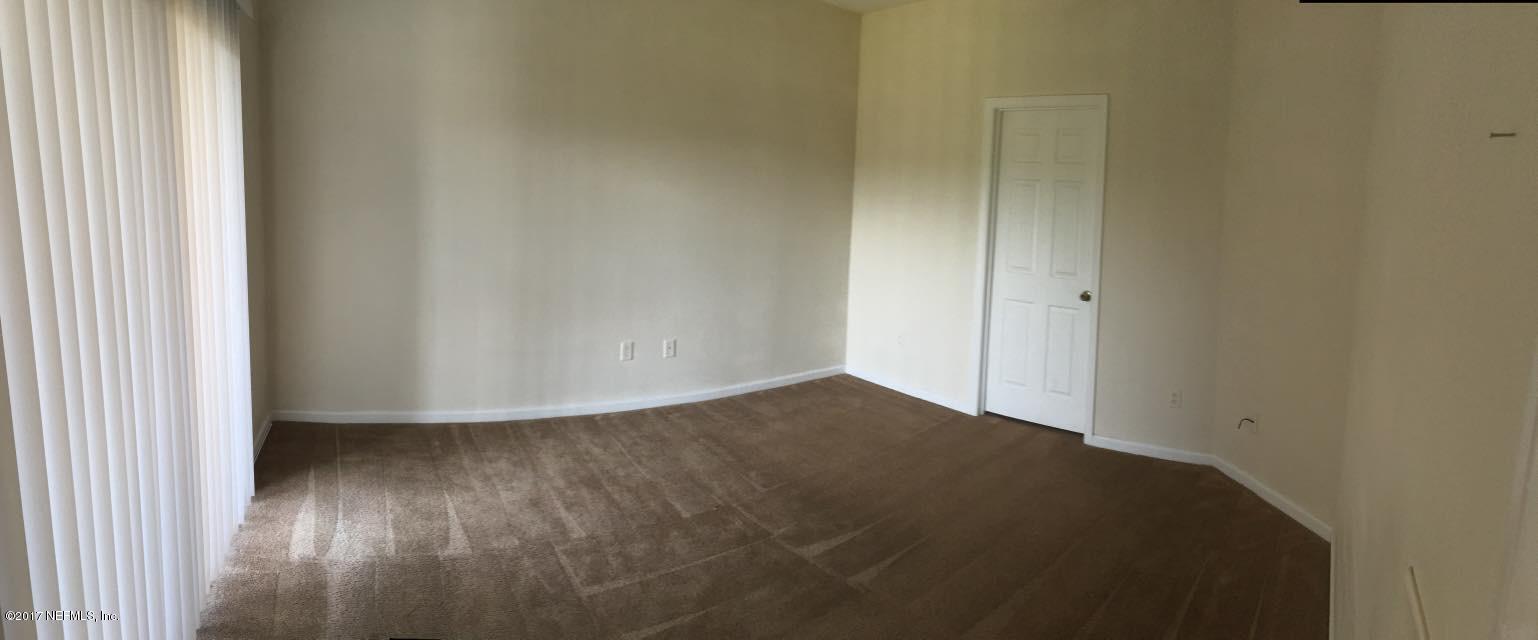 12301 Kernan Forest Boulevard, Unit 2202 Jacksonville, FL 32225 - Photo 13 of 38 a view of empty room with wooden floor