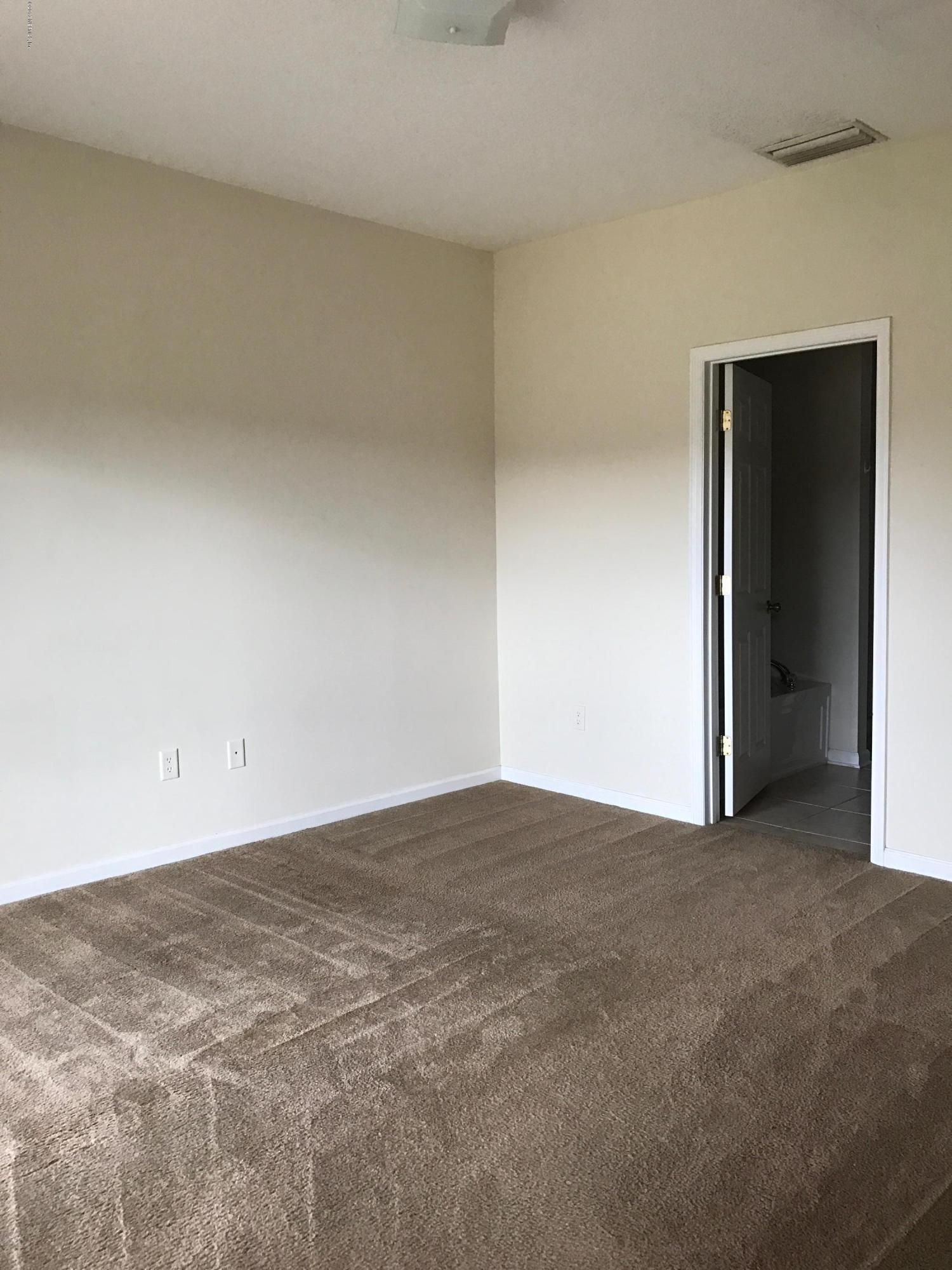 12301 Kernan Forest Boulevard, Unit 2202 Jacksonville, FL 32225 - Photo 23 of 38 a view of an empty room