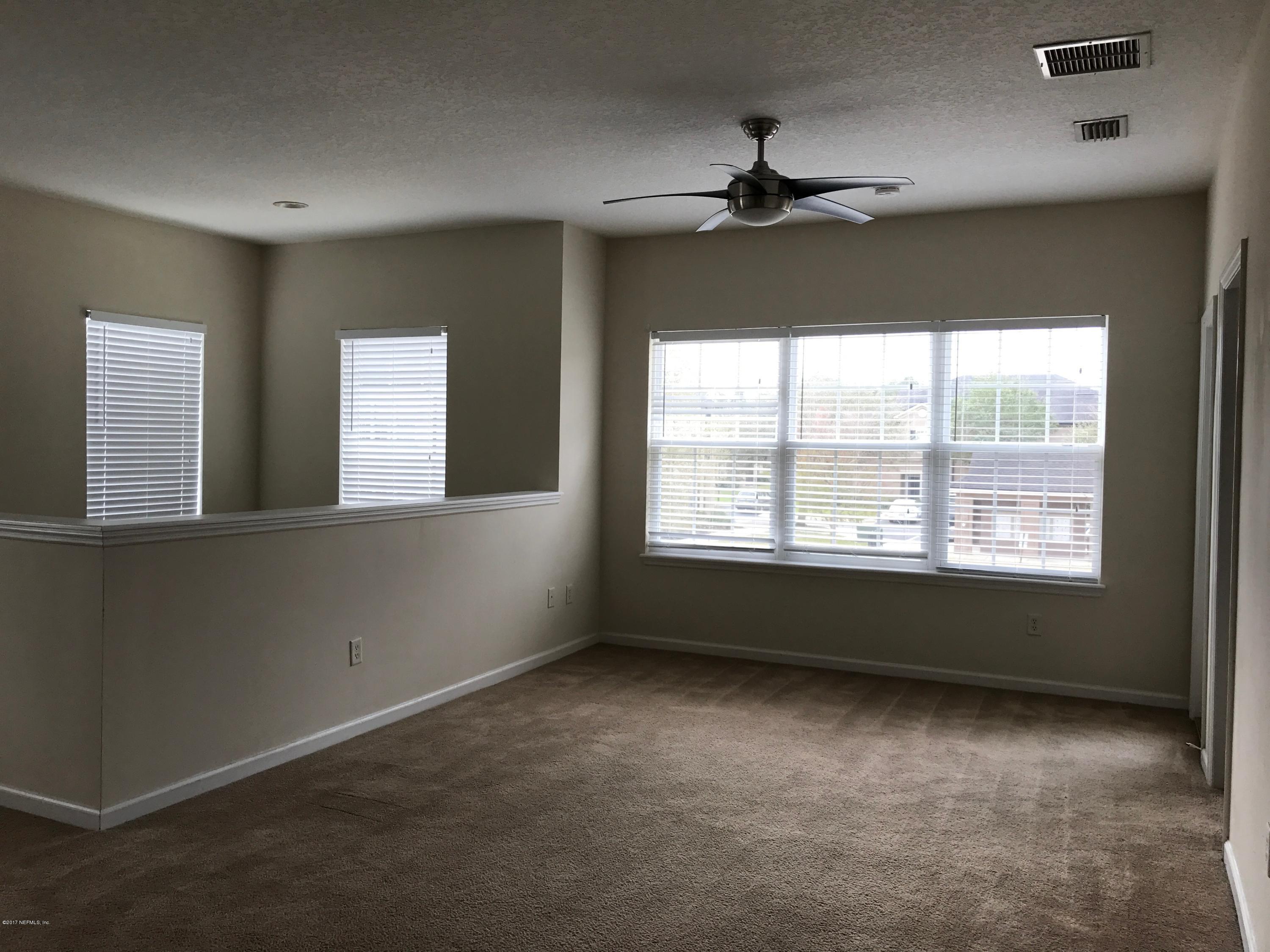 12301 Kernan Forest Boulevard, Unit 2202 Jacksonville, FL 32225 - Photo 25 of 38 a view of an empty room with a window