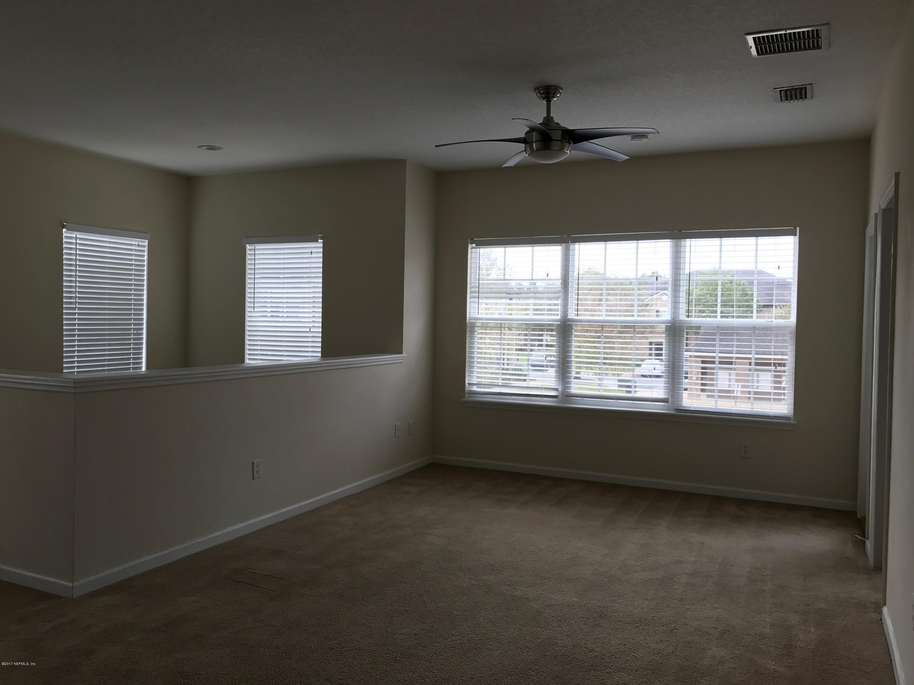 12301 Kernan Forest Boulevard, Unit 2202 Jacksonville, FL 32225 - Photo 27 of 38 a view of an empty room with a window