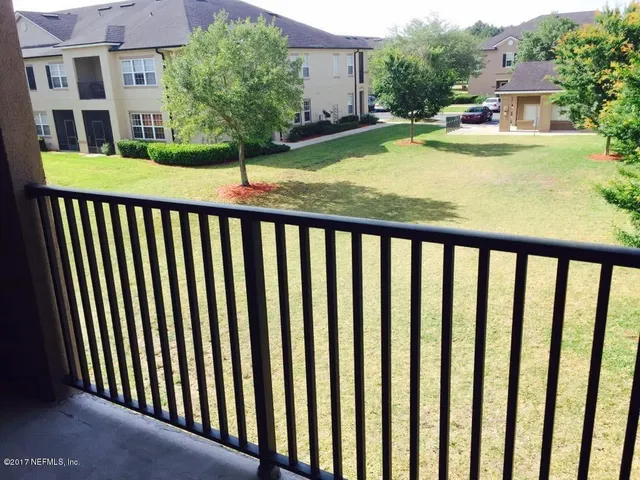 a view of a chair and tables in the patio