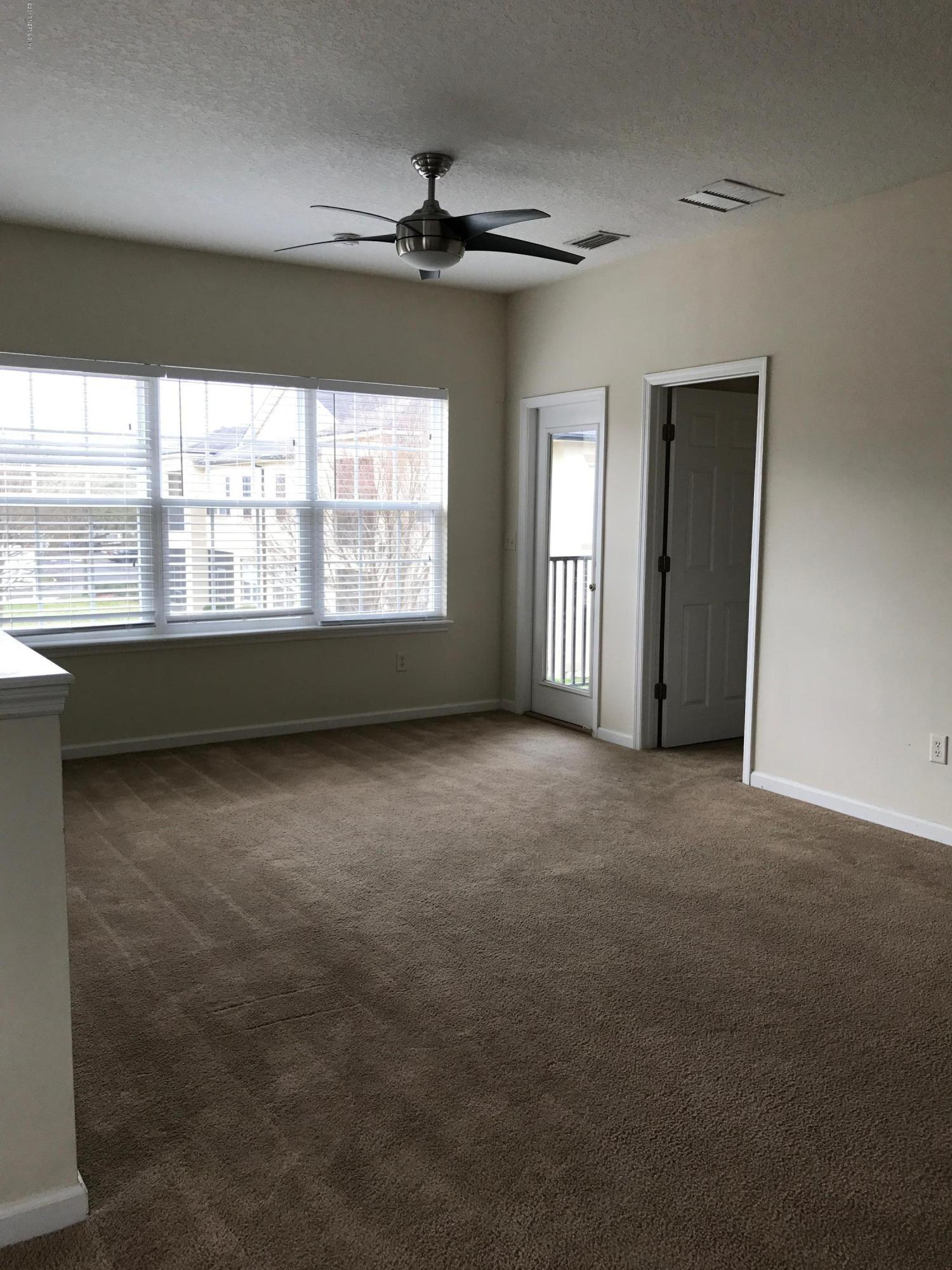 12301 Kernan Forest Boulevard, Unit 2202 Jacksonville, FL 32225 - Photo 31 of 38 a view of an empty room with a window