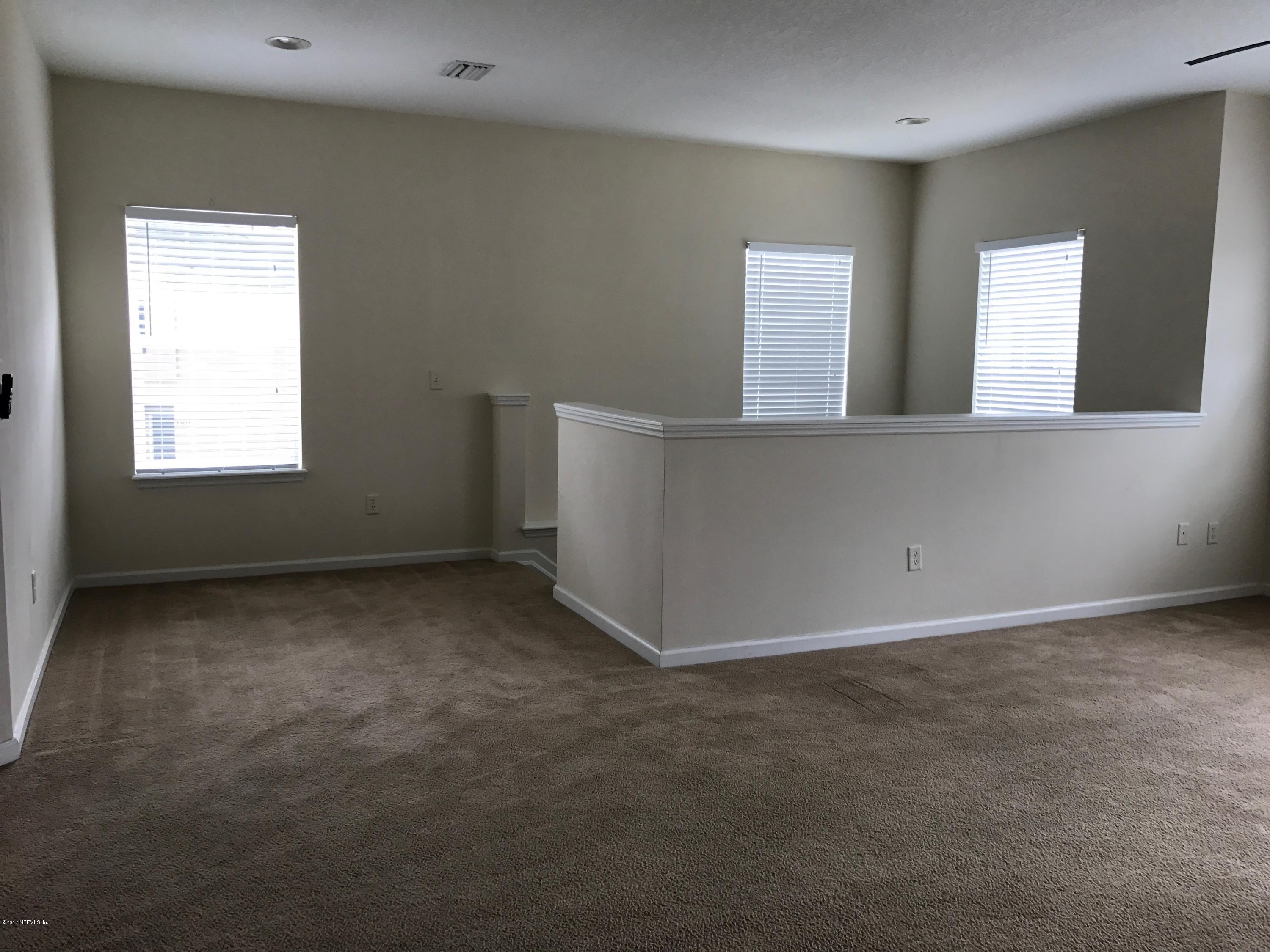 12301 Kernan Forest Boulevard, Unit 2202 Jacksonville, FL 32225 - Photo 32 of 38 a view of an empty room with window