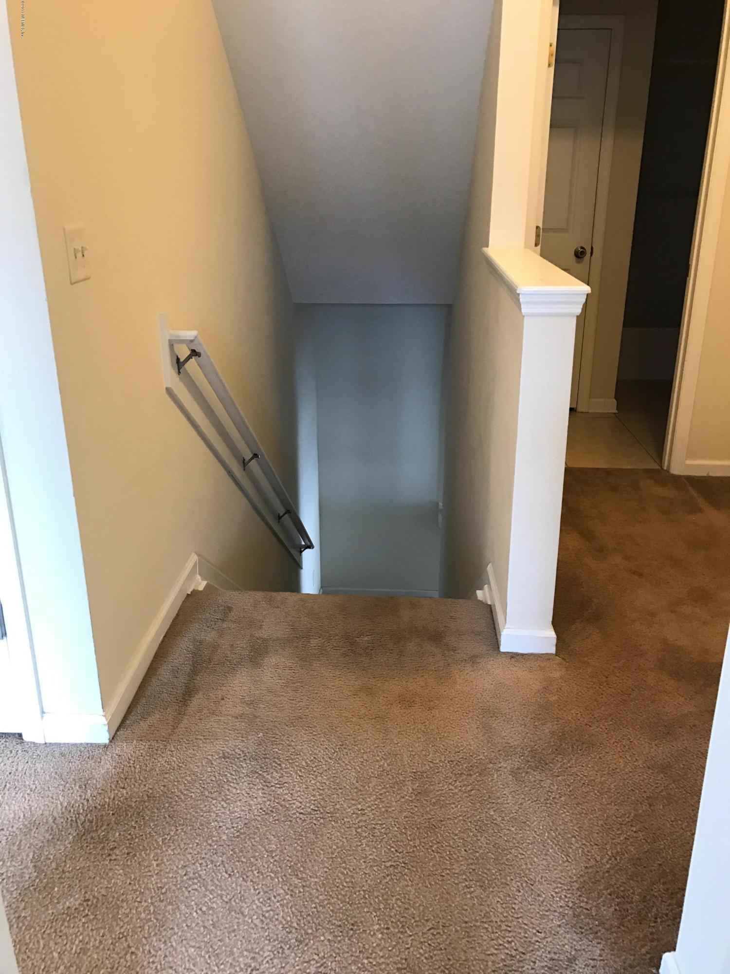 12301 Kernan Forest Boulevard, Unit 2202 Jacksonville, FL 32225 - Photo 34 of 38 a view of empty room with wooden floor and fan