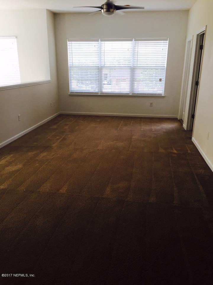 12301 Kernan Forest Boulevard, Unit 2202 Jacksonville, FL 32225 - Photo 8 of 38 a view of an empty room with a window