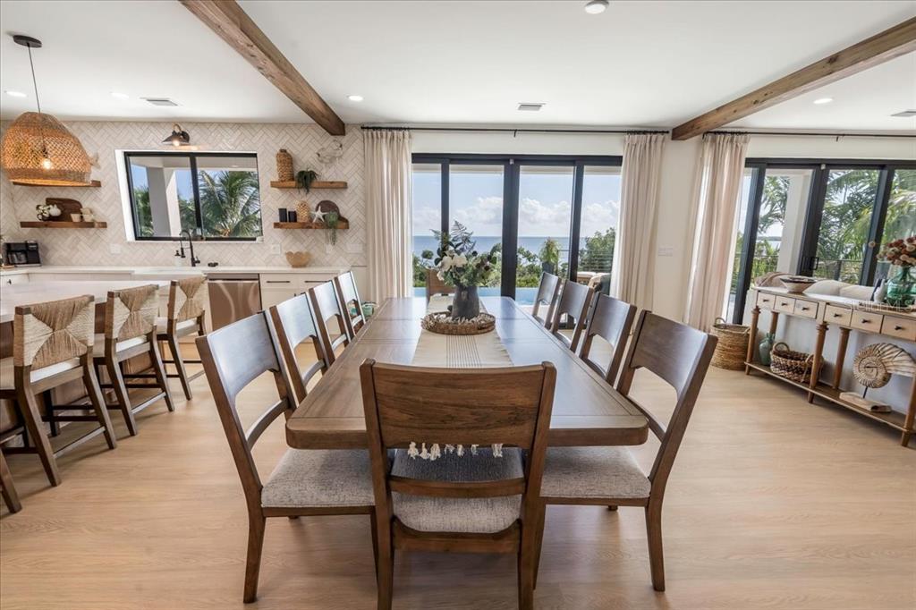 1000 68th Street Marathon, FL 33050 - Photo 31 of 75 a view of a dining room with furniture large windows and wooden floor