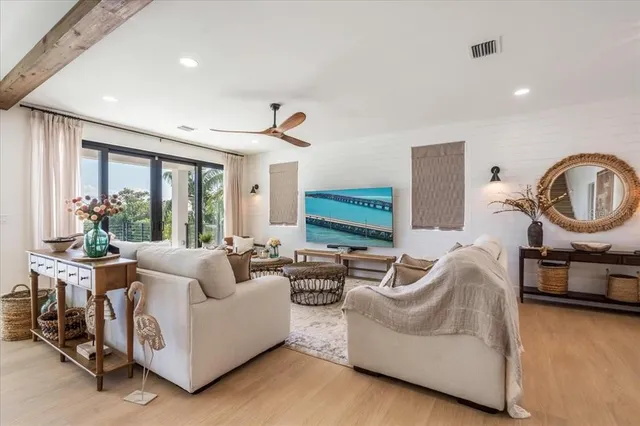 a spacious bedroom with a large bed and a large window