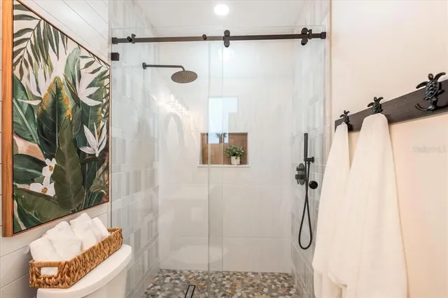 a bedroom with bed and a window