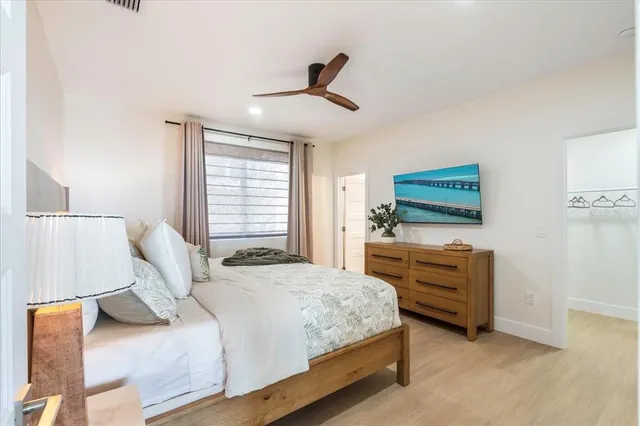 a bed room with a bed and a night stand