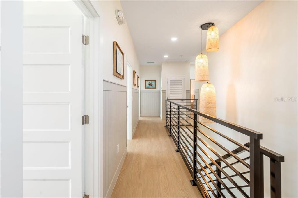 1000 68th Street Marathon, FL 33050 - Photo 43 of 75 a view of a hallway with wooden floor and staircase