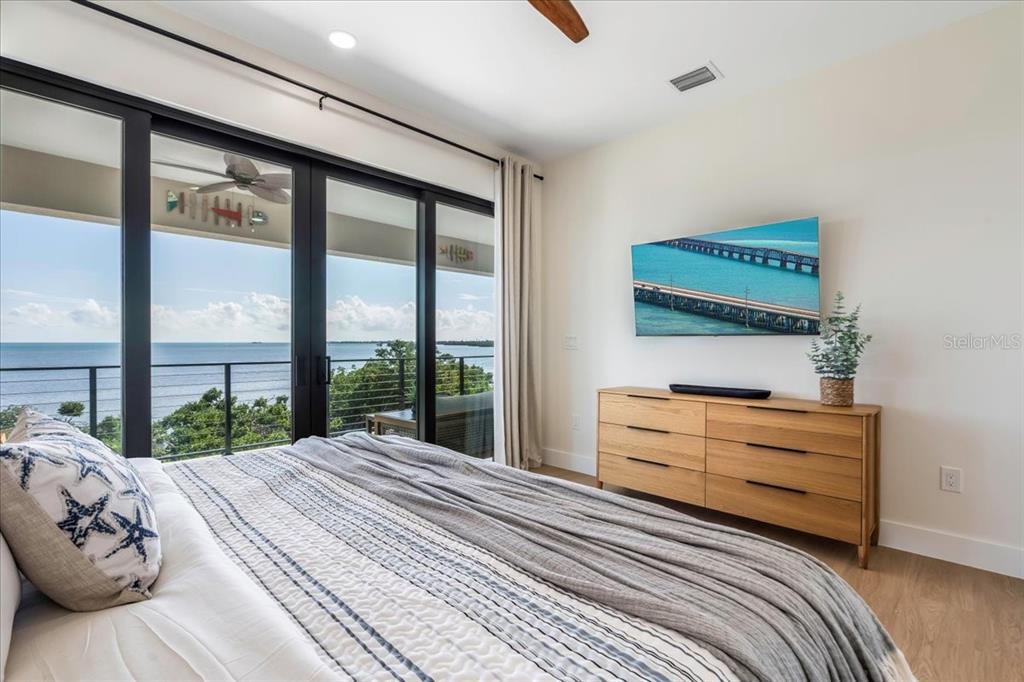 1000 68th Street Marathon, FL 33050 - Photo 46 of 75 a bedroom with a bed and a large window