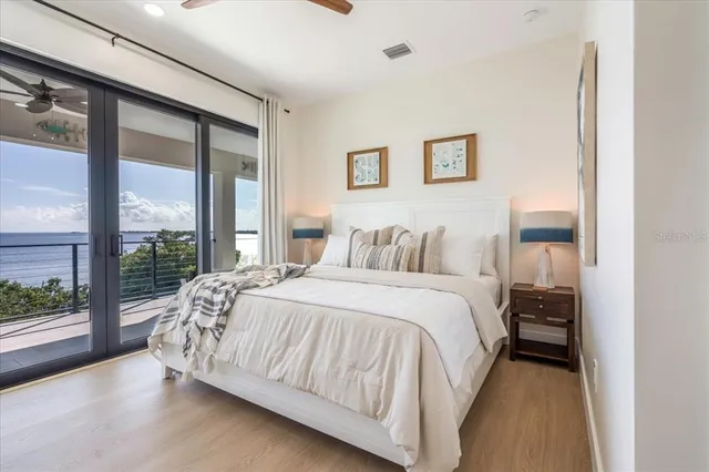 a bedroom with a large bed and a window