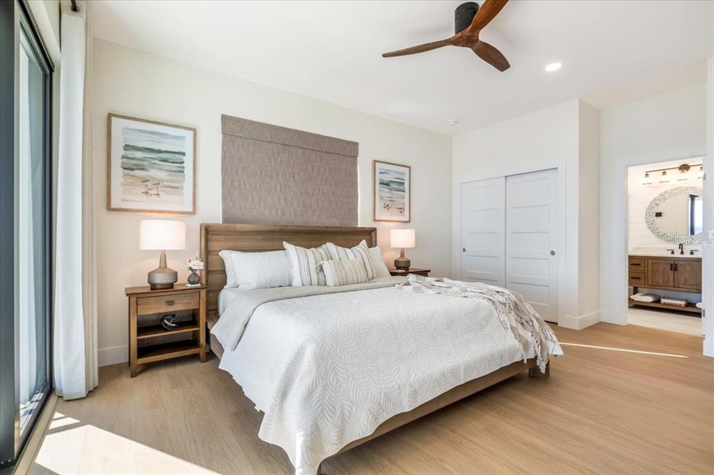 1000 68th Street Marathon, FL 33050 - Photo 54 of 75 a bedroom with a bed and a large mirror