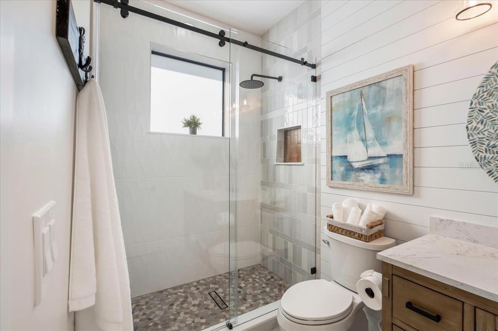 1000 68th Street Marathon, FL 33050 - Photo 58 of 75 a bathroom with a shower a toilet and a sink